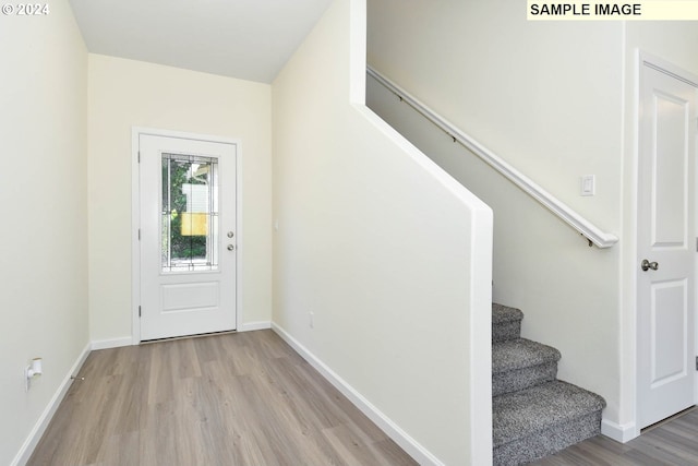3907 SW Duniway Ln, Gresham, OR 97080 - entrance foyer featuring wood finished floors, stairway, and baseboards