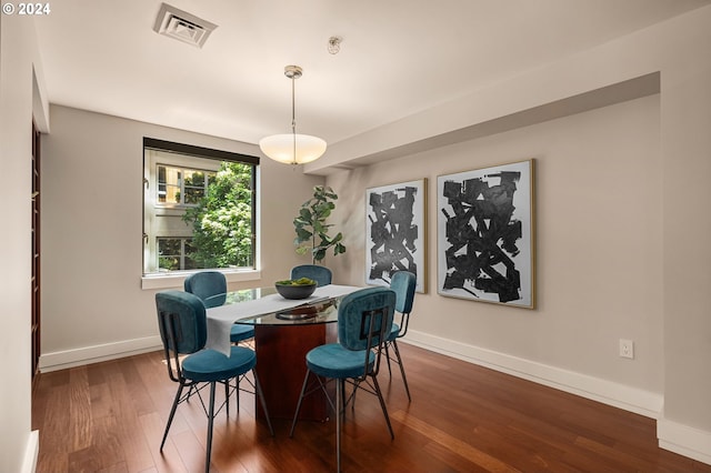 dining room with hardwood / wood-style floors