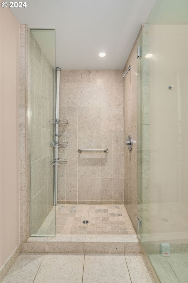 bathroom with a shower with shower door