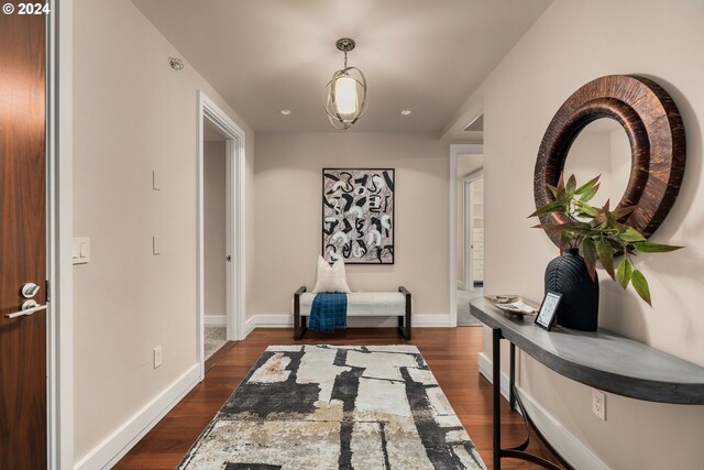 corridor with dark hardwood / wood-style floors