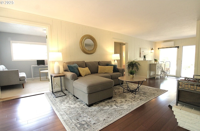 1400 W 40th St, Eugene, OR 97405 - living room featuring a wall mounted AC and hardwood / wood-style floors