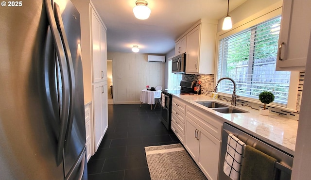 1400 W 40th St, Eugene, OR 97405 - kitchen featuring stainless steel appliances, a sink, decorative backsplash, a wall unit AC, and white cabinets