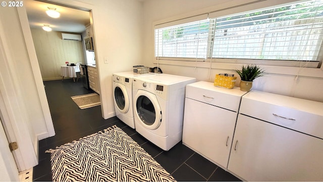 1400 W 40th St, Eugene, OR 97405 - laundry room with washing machine and dryer, an AC wall unit, and dark tile patterned flooring