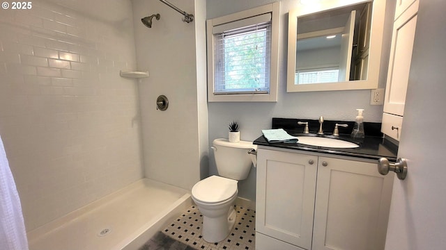 1400 W 40th St, Eugene, OR 97405 - bathroom featuring toilet, a tile shower, and vanity