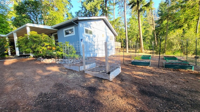 1400 W 40th St, Eugene, OR 97405 - view of outdoor structure with a vegetable garden