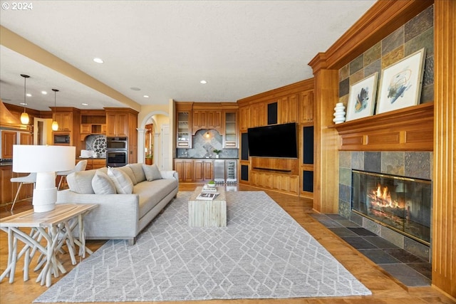 living room featuring a fireplace and light hardwood / wood-style floors