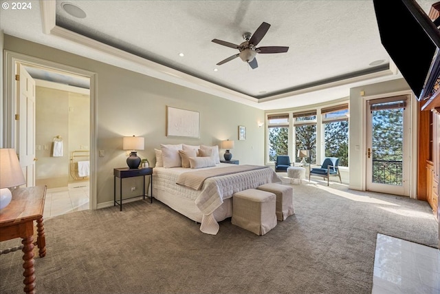 carpeted bedroom featuring access to outside, a tray ceiling, a textured ceiling, and ceiling fan