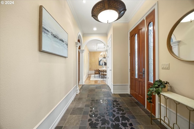 hallway with crown molding and decorative columns