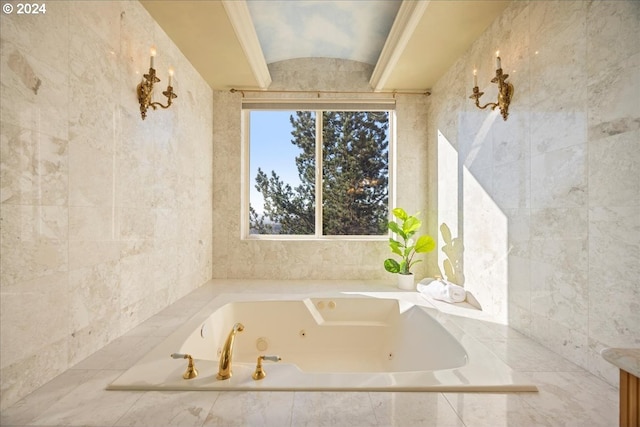 bathroom featuring tile walls and tiled tub