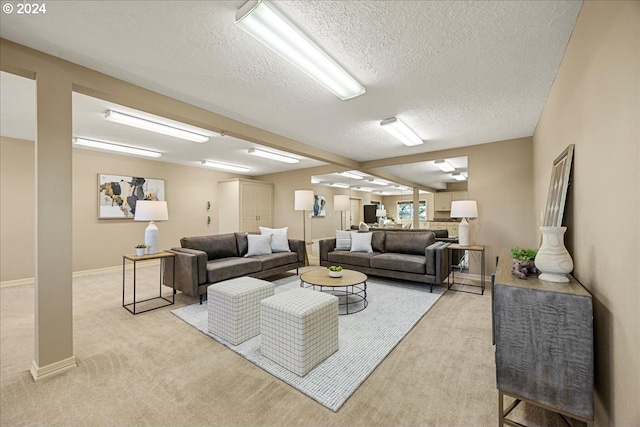 living room featuring a textured ceiling and light carpet