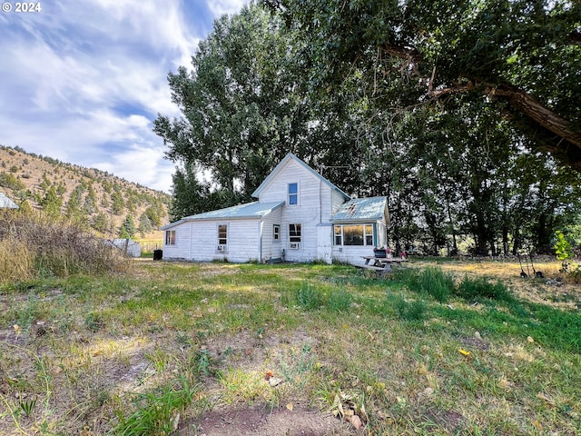 back of property with metal roof