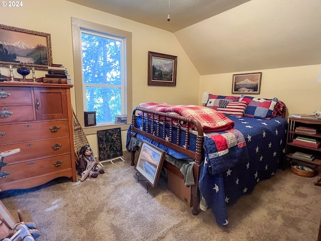 carpeted bedroom featuring vaulted ceiling