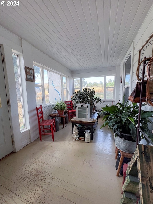 sunroom / solarium featuring wood ceiling and cooling unit