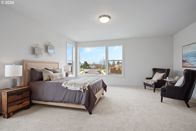 bedroom featuring light carpet