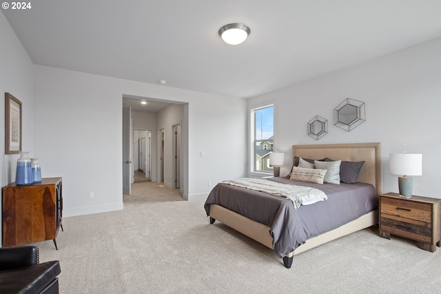 bedroom with light carpet