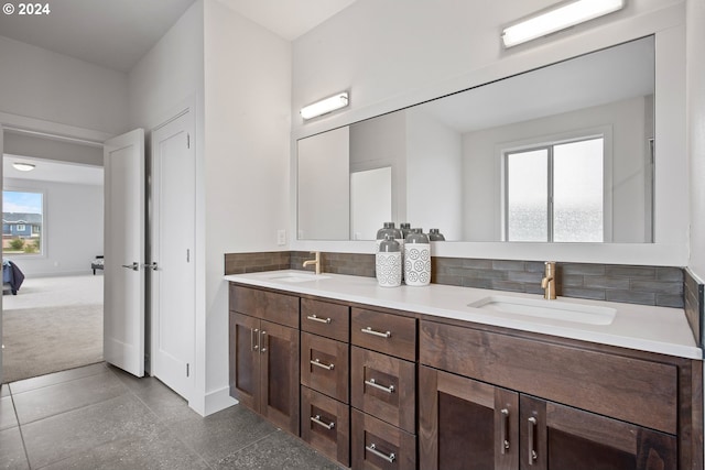 bathroom with backsplash and vanity