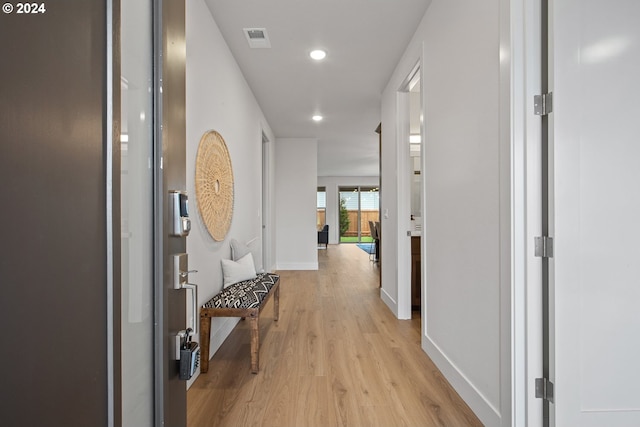 corridor with light wood-type flooring