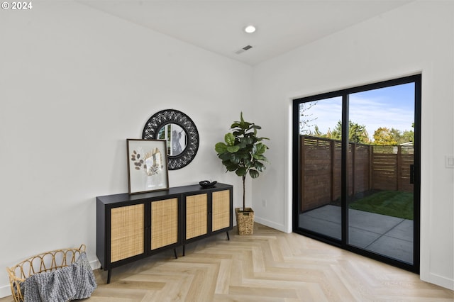 entryway with light parquet floors