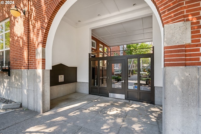 property entrance with brick siding