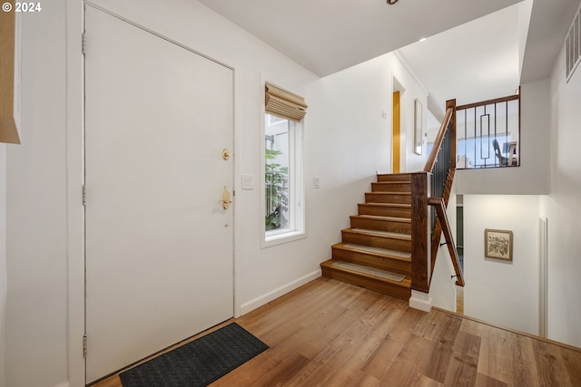 foyer entrance with light wood-type flooring