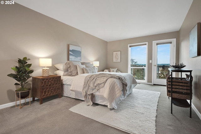 carpeted bedroom featuring access to outside