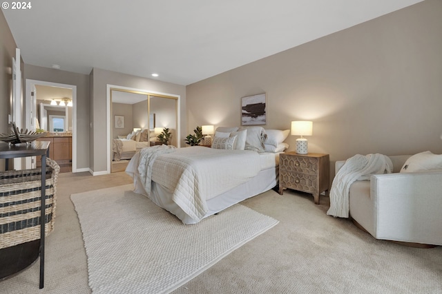 bedroom featuring light carpet and a closet