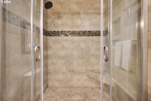 bathroom featuring an enclosed shower