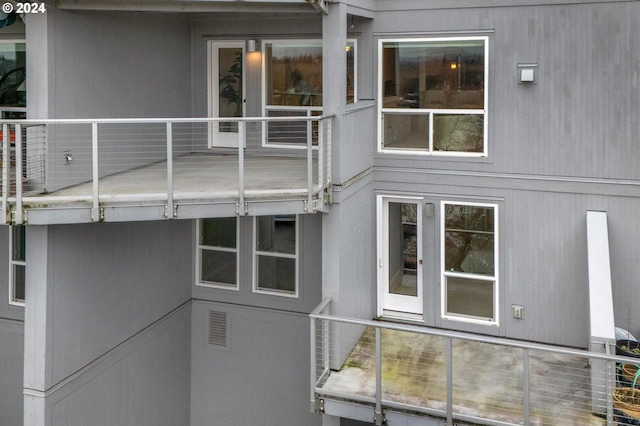 back of house with a balcony