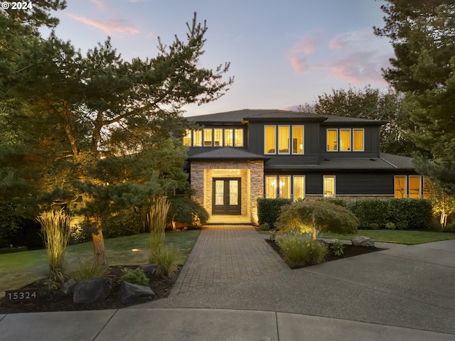 prairie-style home with a lawn