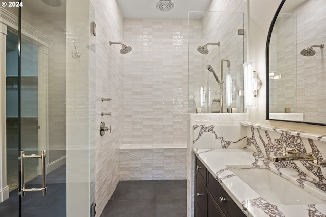 bathroom with vanity, an enclosed shower, and tile patterned floors