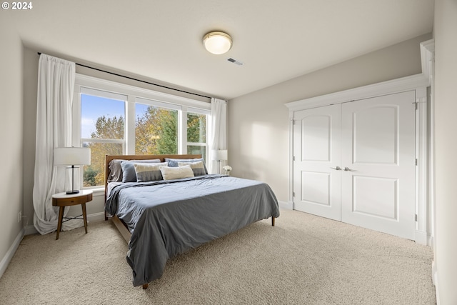 bedroom with light colored carpet