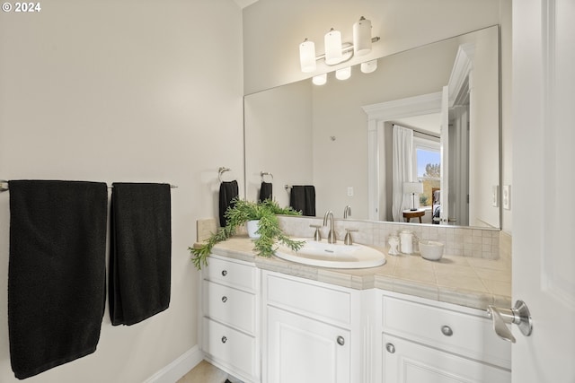 bathroom with vanity and backsplash