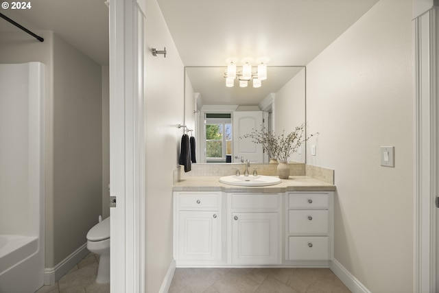 bathroom featuring toilet, vanity, and tile patterned floors