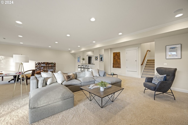 living room featuring ornamental molding and light colored carpet