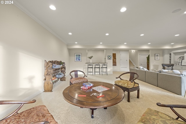 carpeted living room with crown molding