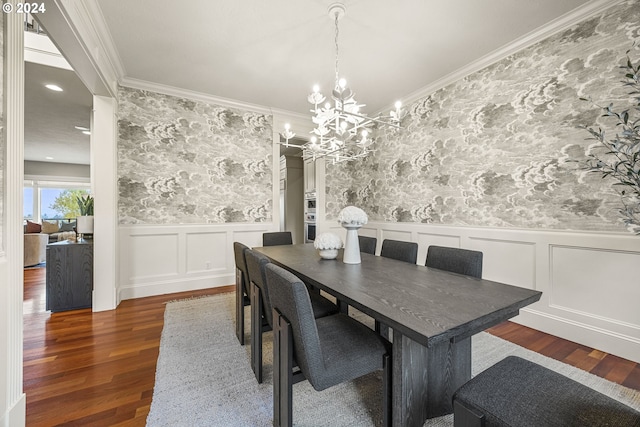 dining area featuring a chandelier, dark hardwood / wood-style flooring, and ornamental molding