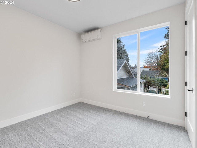 carpeted empty room featuring a wall mounted AC