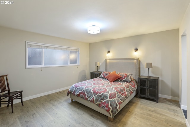 bedroom with light wood-type flooring