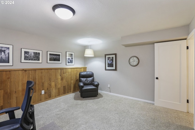 unfurnished office with carpet and wood walls