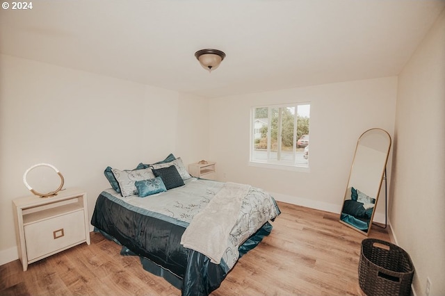 bedroom with light wood-type flooring