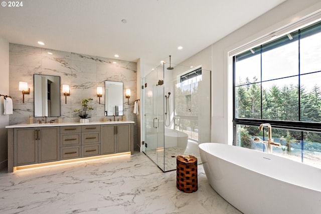 bathroom featuring tile walls, independent shower and bath, and vanity