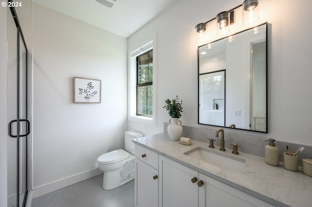 bathroom featuring vanity, toilet, tile patterned floors, and a shower with door