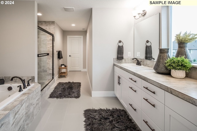 bathroom featuring tile patterned floors, vanity, and shower with separate bathtub