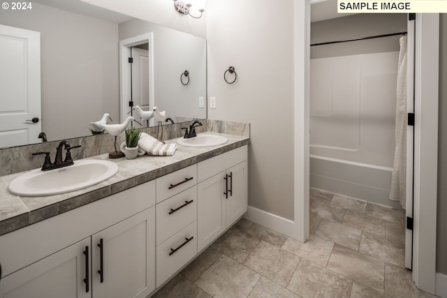 bathroom featuring vanity and shower / bath combination with curtain