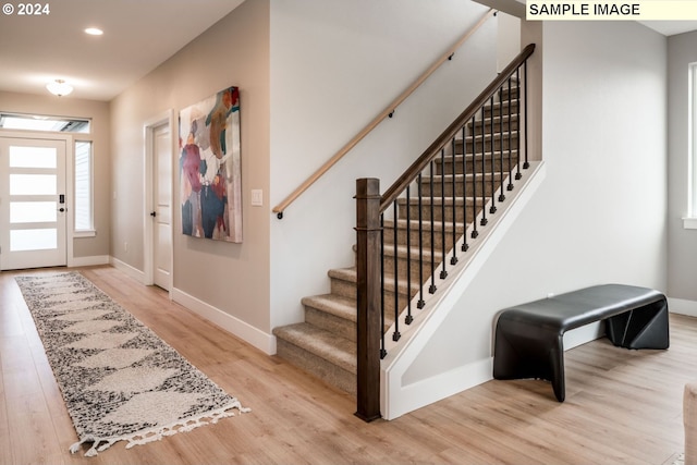 foyer with light hardwood / wood-style flooring