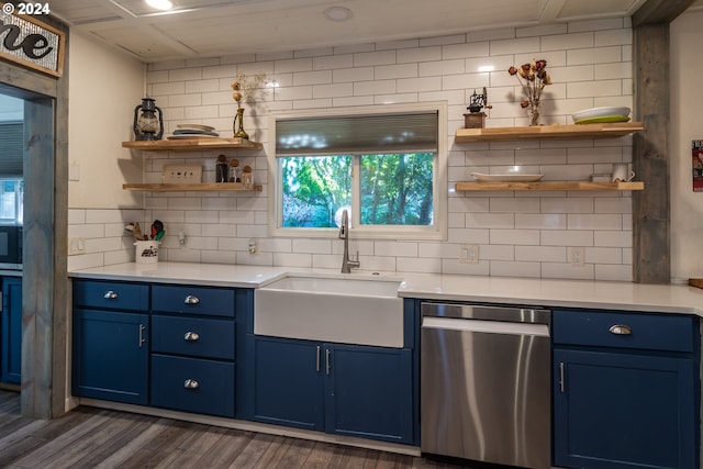 kitchen with dishwasher, dark wood-type flooring, backsplash, sink, and blue cabinetry