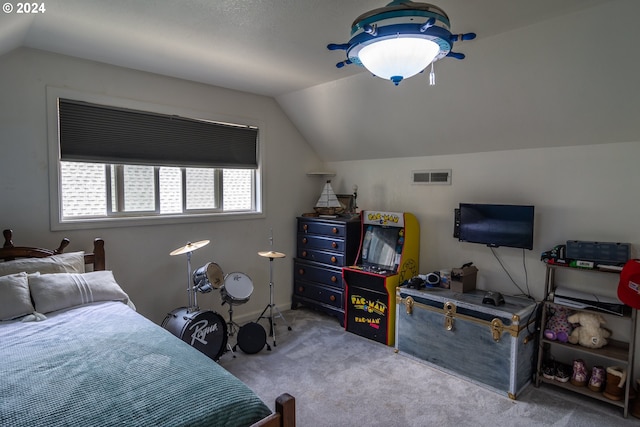 bedroom featuring lofted ceiling and light colored carpet