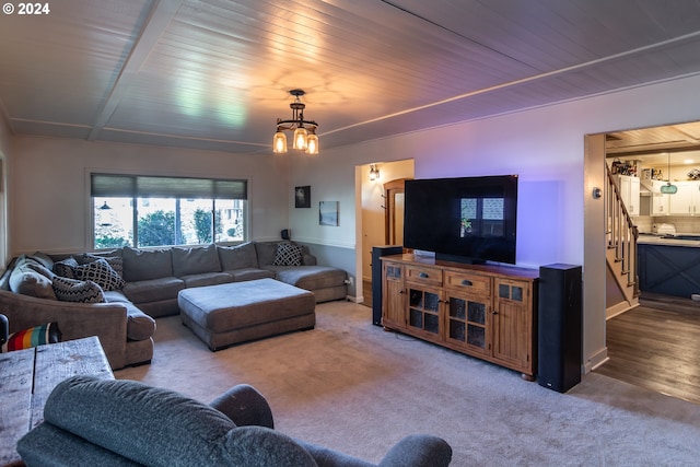 living room with an inviting chandelier and hardwood / wood-style floors