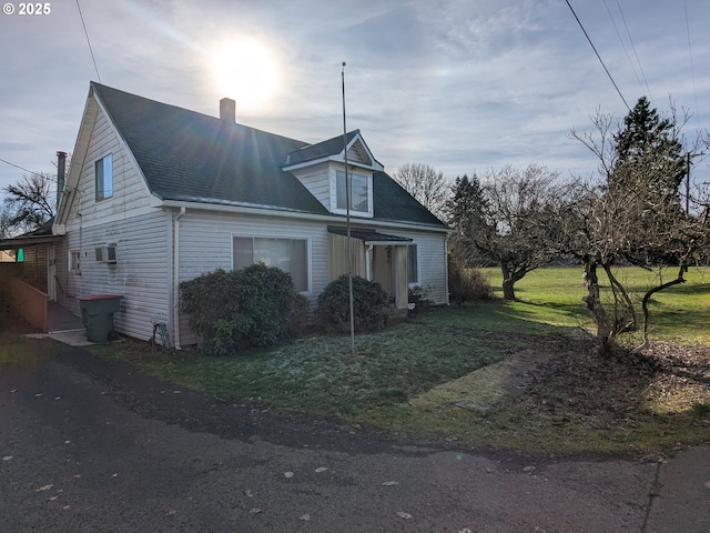 view of home's exterior featuring a lawn