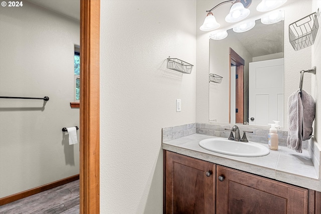 bathroom featuring hardwood / wood-style floors and vanity